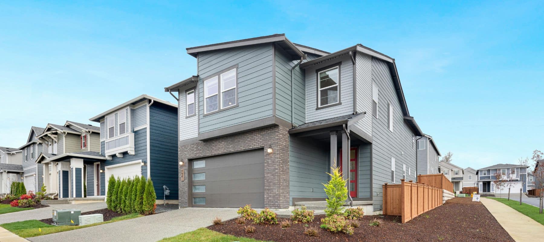 Contemporary gray two-story home in a suburban neighborhood